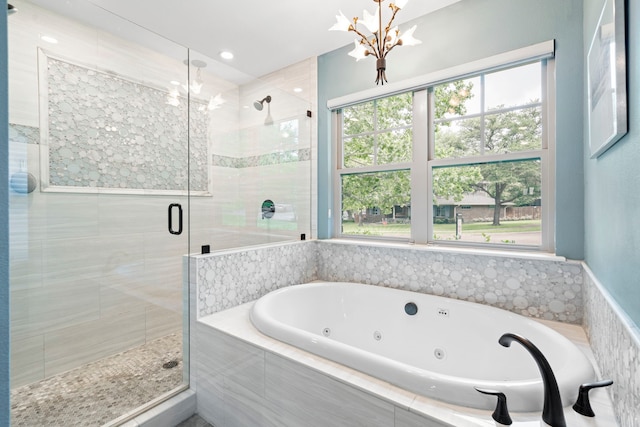 8928 Aldwick Cir, Dallas, TX 75238 - full bathroom with a stall shower, a whirlpool tub, plenty of natural light, and a chandelier