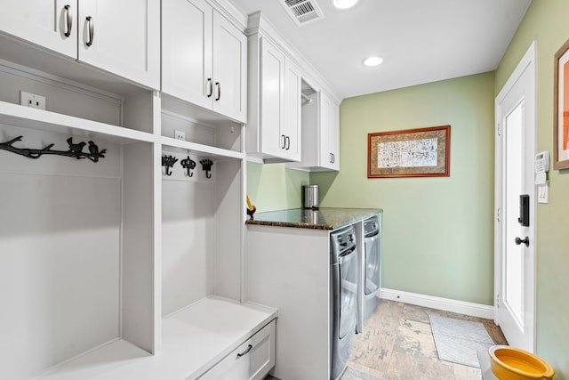 8928 Aldwick Cir, Dallas, TX 75238 - mudroom with washer and dryer, recessed lighting, and light stone finish floors
