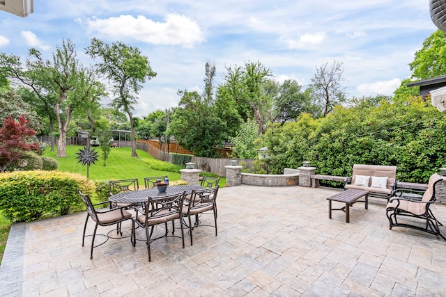 8928 Aldwick Cir, Dallas, TX 75238 - fenced backyard featuring a patio, outdoor dining area, and an outdoor hangout area