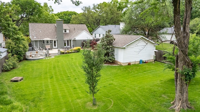 8928 Aldwick Cir, Dallas, TX 75238 - back of house with a shingled roof and a chimney