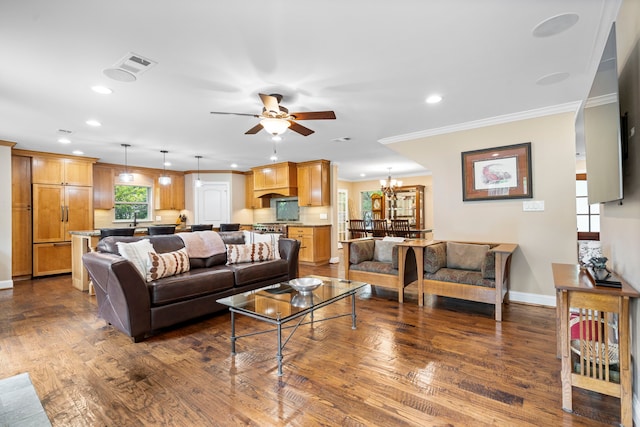 8928 Aldwick Cir, Dallas, TX 75238 - living room featuring ceiling fan, recessed lighting, dark wood finished floors, ornamental molding, and a chandelier