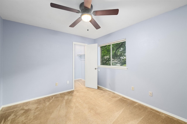 123 Austin Stone Dr, Duncanville, TX 75137 - unfurnished bedroom featuring carpet floors, a spacious closet, ceiling fan, and a closet