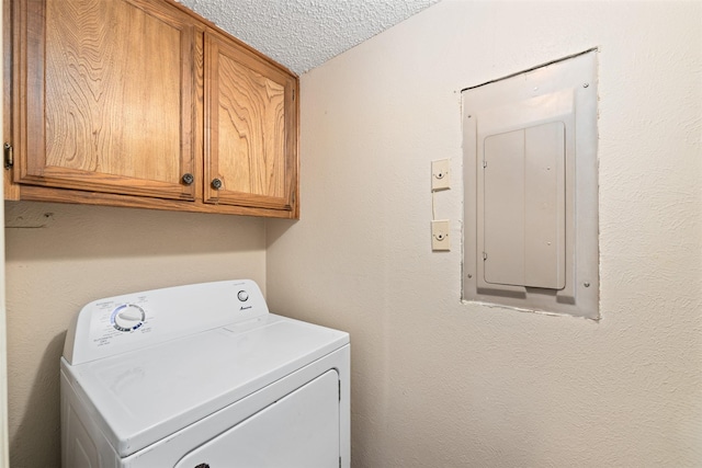 123 Austin Stone Dr, Duncanville, TX 75137 - laundry area with washer / clothes dryer, electric panel, cabinet space, and a textured ceiling