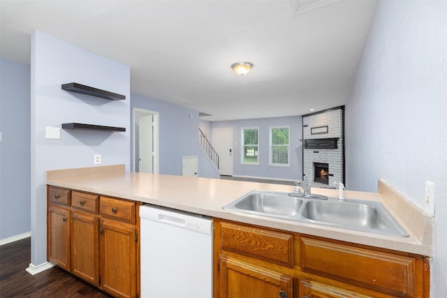 123 Austin Stone Dr, Duncanville, TX 75137 - kitchen featuring dishwasher, dark wood finished floors, light countertops, a fireplace, and a peninsula