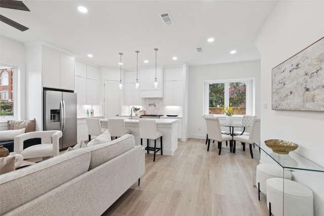 1000 W 10th St, Dallas, TX 75208 - living room featuring recessed lighting, light wood-style flooring, and ceiling fan