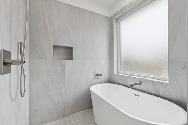 1000 W 10th St, Dallas, TX 75208 - full bathroom featuring a freestanding bath and tile walls
