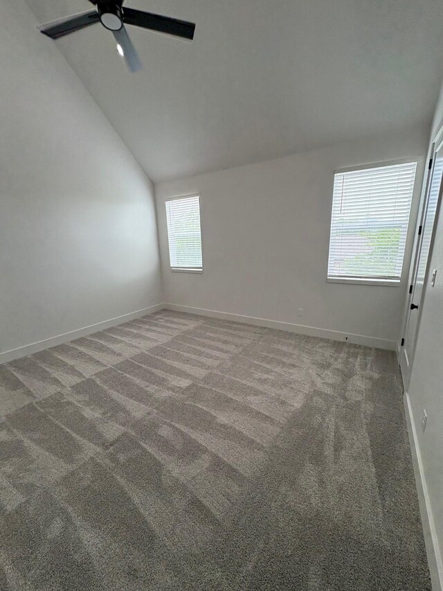 1147 N Madison Ave Unit 102, Dallas, TX 75208 - unfurnished room featuring a ceiling fan, carpet, and vaulted ceiling
