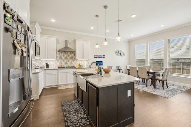 1330 Heavenly Pl, Wylie, TX 75098 - kitchen with stainless steel appliances, wall chimney range hood, dark wood-style floors, tasteful backsplash, and ornamental molding