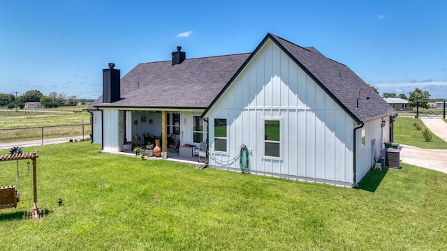 1401 County Road 1470, Chico, TX 76431 - rear view of property with board and batten siding, a chimney, roof with shingles, and a patio area