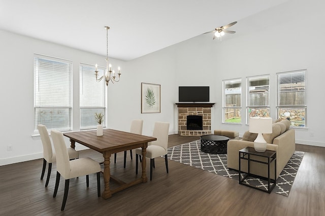 1519 Calcot Ln, Forney, TX 75126 - dining space featuring dark wood-type flooring, a chandelier, ceiling fan, and a fireplace