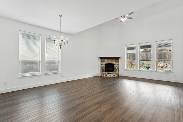 1519 Calcot Ln, Forney, TX 75126 - unfurnished living room featuring plenty of natural light, a chandelier, a fireplace, and dark wood finished floors