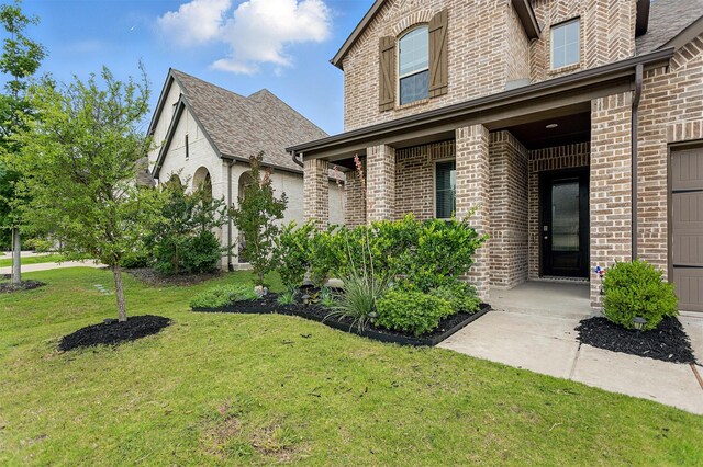 1519 Calcot Ln, Forney, TX 75126 - view of front of property with brick siding, a front lawn, and a shingled roof