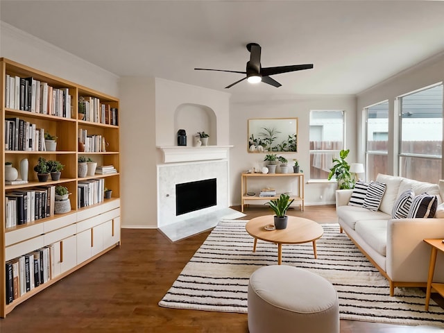 5413 Mohawk Ct, The Colony, TX 75056 - living area featuring a ceiling fan, a fireplace with flush hearth, and wood finished floors