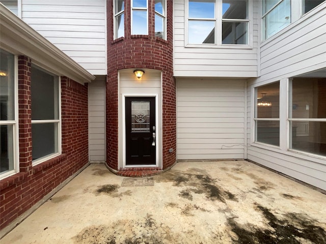 5413 Mohawk Ct, The Colony, TX 75056 - entrance to property with brick siding and a patio area