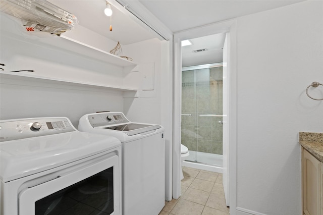 4555 N O Connor Rd Unit 2278, Irving, TX 75062 - laundry room with light tile patterned floors and separate washer and dryer