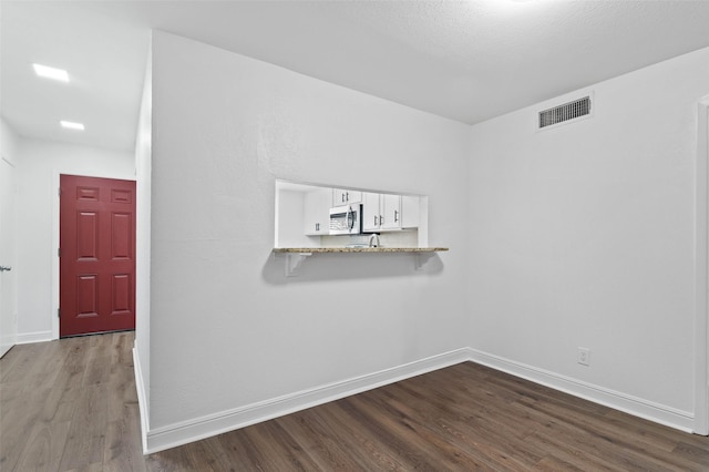 4555 N O Connor Rd Unit 2278, Irving, TX 75062 - spare room with dark wood finished floors and baseboards
