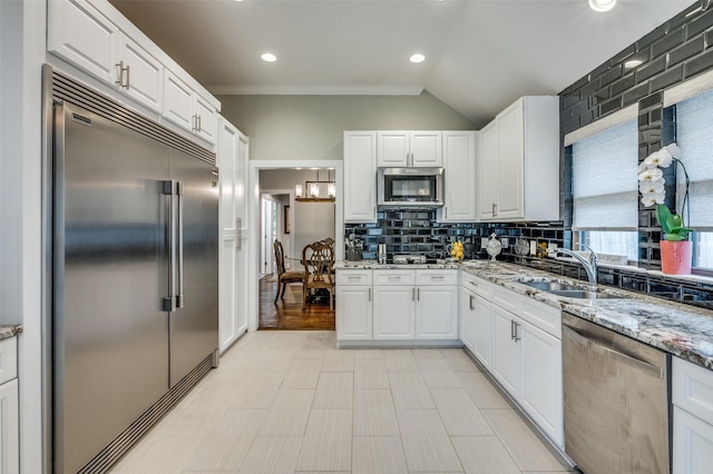 4320 Country Ln, Grapevine, TX 76051 - kitchen featuring stainless steel appliances, white cabinets, tasteful backsplash, light stone counters, and recessed lighting