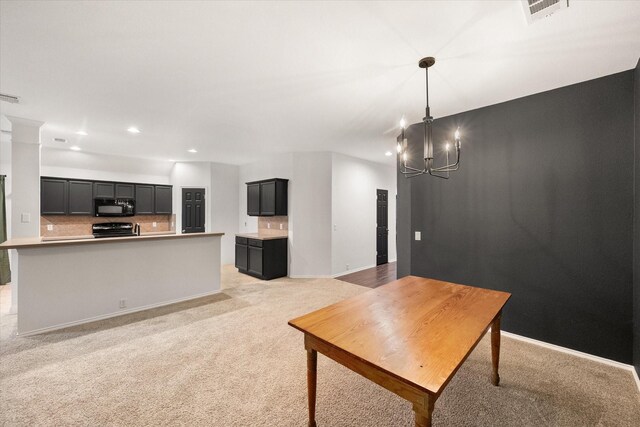 1003 Rosita St, Arlington, TX 76002 - living room with recessed lighting, light carpet, and a chandelier