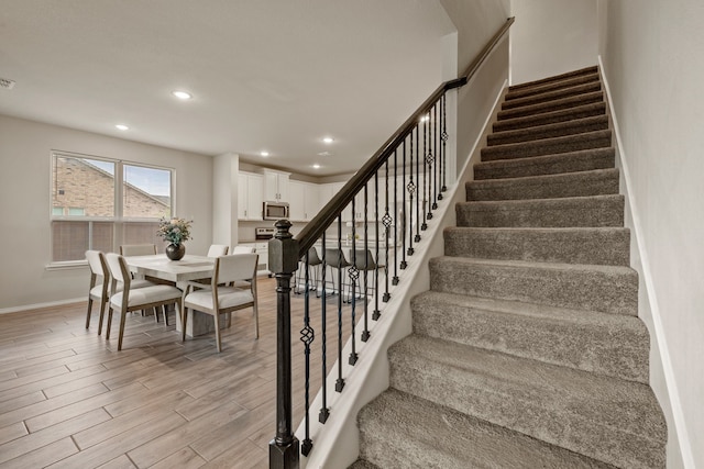 3018 Dakota Trl, Crandall, TX 75114 - staircase with wood finished floors and recessed lighting
