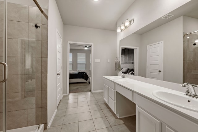 3018 Dakota Trl, Crandall, TX 75114 - ensuite bathroom featuring double vanity, a stall shower, tile patterned floors, and ceiling fan