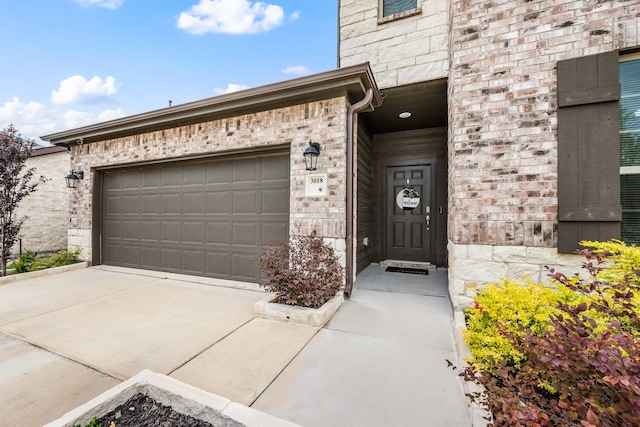 3018 Dakota Trl, Crandall, TX 75114 - view of exterior entry with a garage, driveway, and brick siding