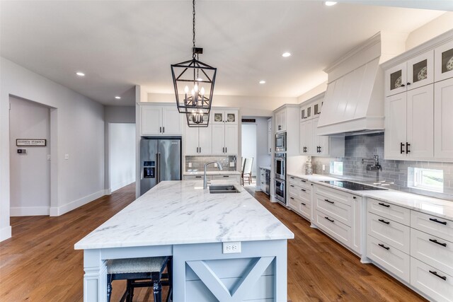 1757 Country Club Rd, Bowie, TX 76230 - kitchen with stainless steel appliances, decorative backsplash, recessed lighting, premium range hood, and a chandelier