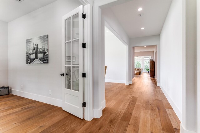1757 Country Club Rd, Bowie, TX 76230 - corridor with light wood finished floors and recessed lighting