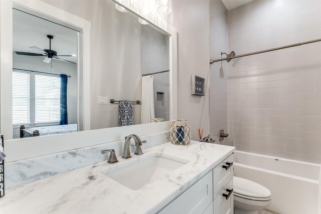 1757 Country Club Rd, Bowie, TX 76230 - bathroom with vanity, a ceiling fan, shower / bathtub combination with curtain, and ensuite bathroom