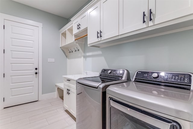 1757 Country Club Rd, Bowie, TX 76230 - laundry room with washer and dryer and cabinet space