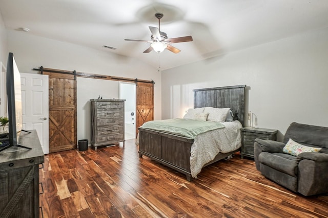 1323 Canyon Creek Rd, Wylie, TX 75098 - bedroom featuring a barn door, dark wood-style flooring, and a ceiling fan