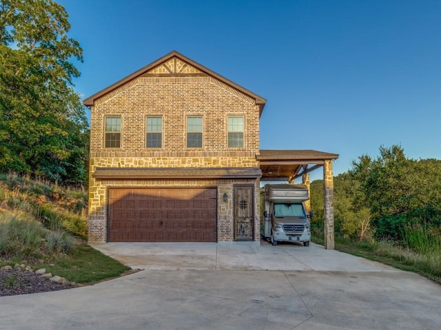 165 Cote D Azur, Chico, TX 76431 - view of front of home featuring driveway, an attached garage, brick siding, and a carport