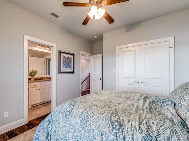 165 Cote D Azur, Chico, TX 76431 - bedroom featuring dark wood finished floors, a closet, connected bathroom, and ceiling fan