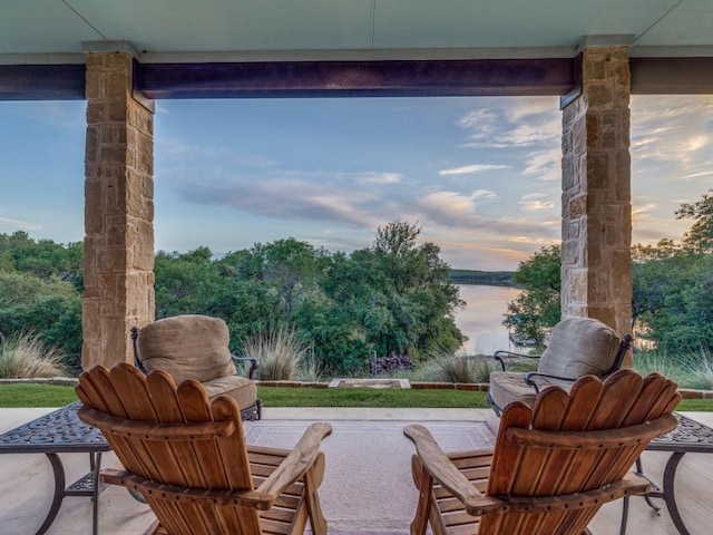 165 Cote D Azur, Chico, TX 76431 - patio terrace at dusk featuring a water view and a patio area