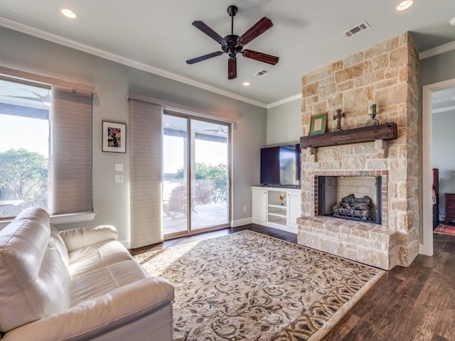 165 Cote D Azur, Chico, TX 76431 - living area with wood finished floors, crown molding, ceiling fan, a stone fireplace, and recessed lighting