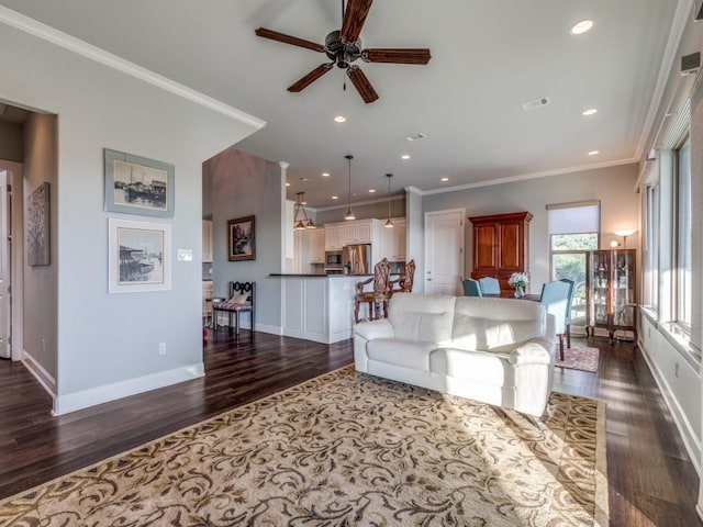 165 Cote D Azur, Chico, TX 76431 - living room with ceiling fan, dark wood-style floors, ornamental molding, and recessed lighting