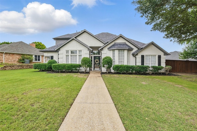 7104 Harlan Dr, Rockwall, TX 75087 - view of front of home featuring brick siding and a shingled roof