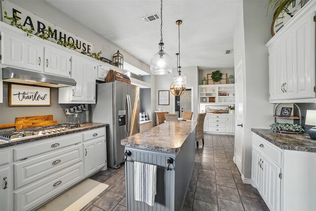 7104 Harlan Dr, Rockwall, TX 75087 - kitchen featuring stainless steel appliances, under cabinet range hood, and white cabinets