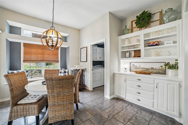 7104 Harlan Dr, Rockwall, TX 75087 - dining room featuring a chandelier and separate washer and dryer