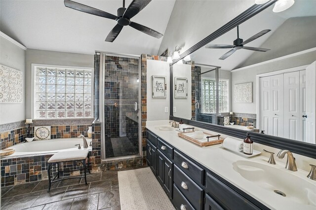 7104 Harlan Dr, Rockwall, TX 75087 - full bath with a ceiling fan, vaulted ceiling, a bath, a shower stall, and double vanity