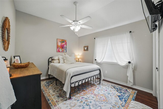 7104 Harlan Dr, Rockwall, TX 75087 - bedroom featuring wood finished floors, lofted ceiling, and a ceiling fan