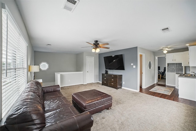7104 Harlan Dr, Rockwall, TX 75087 - living room featuring ceiling fan and dark colored carpet