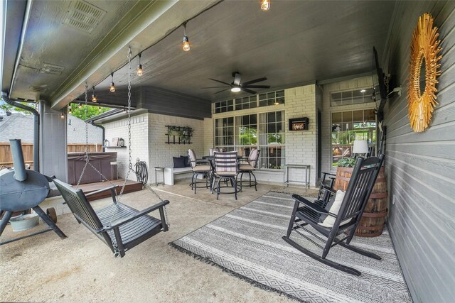 7104 Harlan Dr, Rockwall, TX 75087 - view of patio with a hot tub, ceiling fan, and outdoor dining area