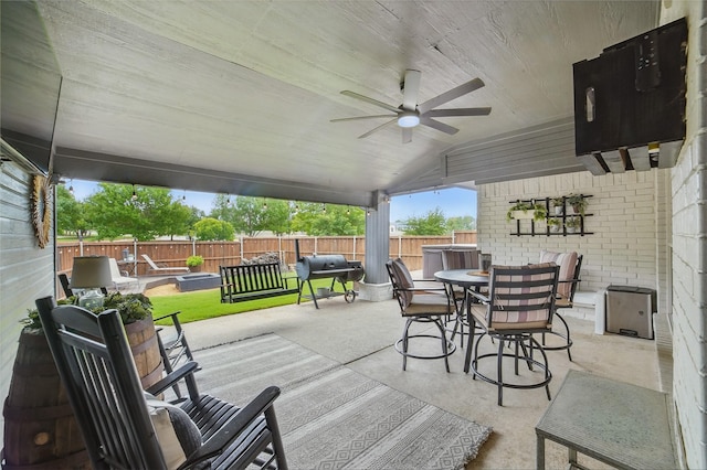 7104 Harlan Dr, Rockwall, TX 75087 - fenced backyard featuring outdoor dining space, a ceiling fan, a patio, and grilling area