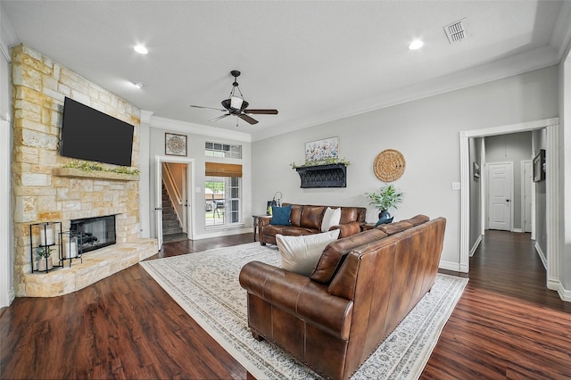 7104 Harlan Dr, Rockwall, TX 75087 - living room featuring a ceiling fan, ornamental molding, wood finished floors, a fireplace, and recessed lighting