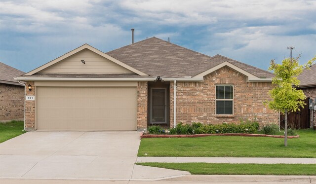 941 Loomis Trl, Justin, TX 76247 - ranch-style house with driveway, an attached garage, a front lawn, roof with shingles, and brick siding
