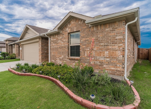 941 Loomis Trl, Justin, TX 76247 - view of front of home with brick siding, an attached garage, and concrete driveway