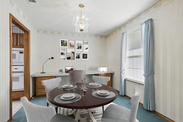 4018 Oakview Cir, Alvarado, TX 76009 - dining area featuring wallpapered walls and a chandelier