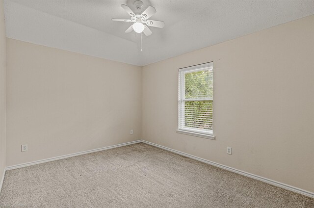 796 Oak Hollow Ln, Rockwall, TX 75087 - carpeted spare room with a ceiling fan and a textured ceiling