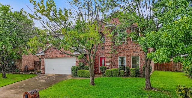 796 Oak Hollow Ln, Rockwall, TX 75087 - traditional-style home with asphalt driveway, brick siding, and a garage