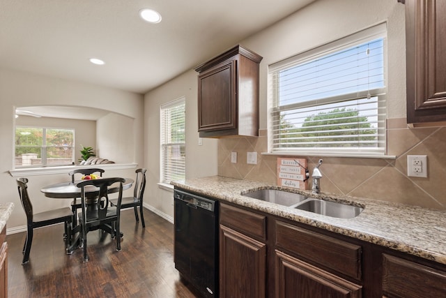 6524 Sheridan Cir, Arlington, TX 76017 - kitchen with black dishwasher, dark wood-style flooring, backsplash, light stone counters, and recessed lighting